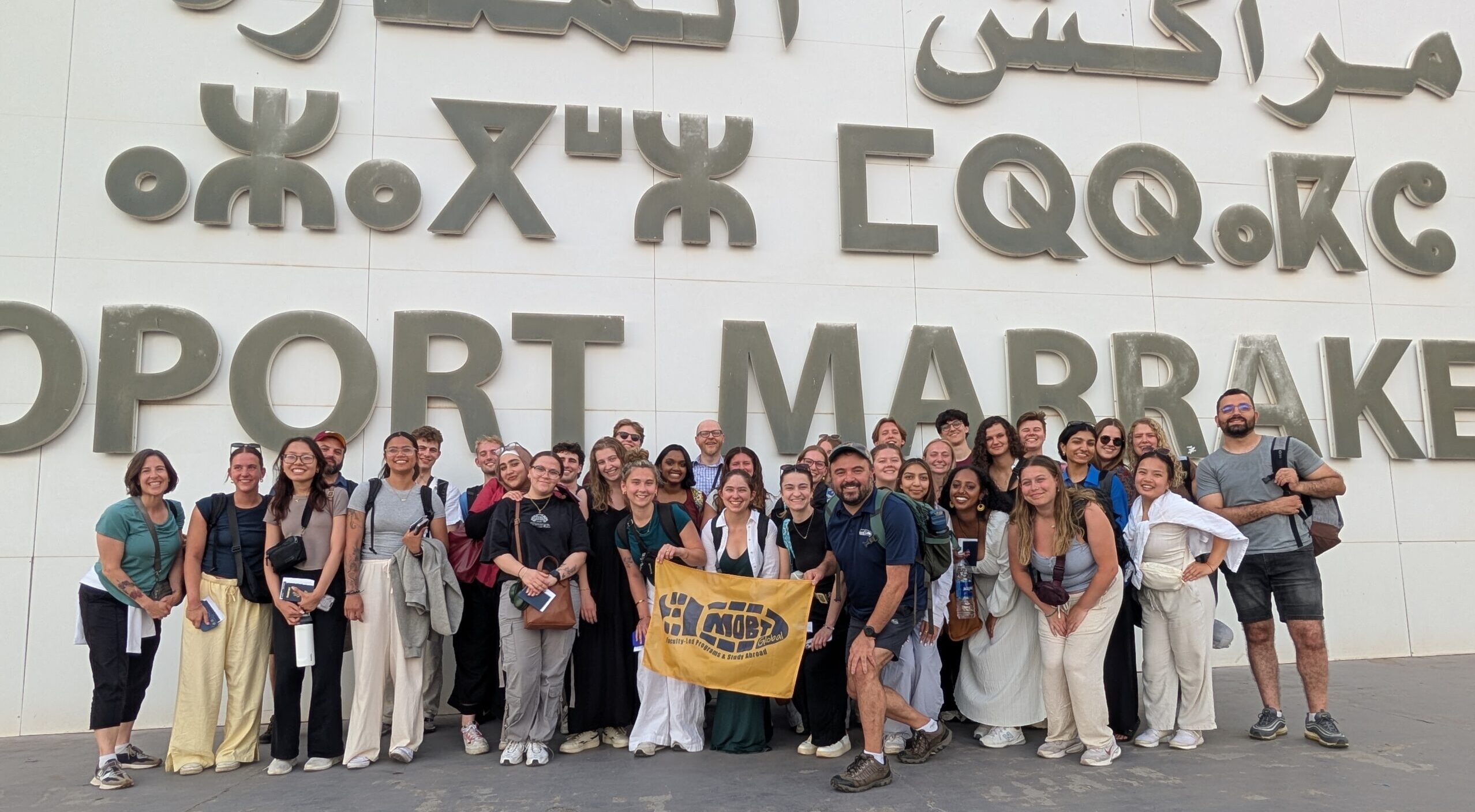 A panel of diverse students and faculty at an international education event