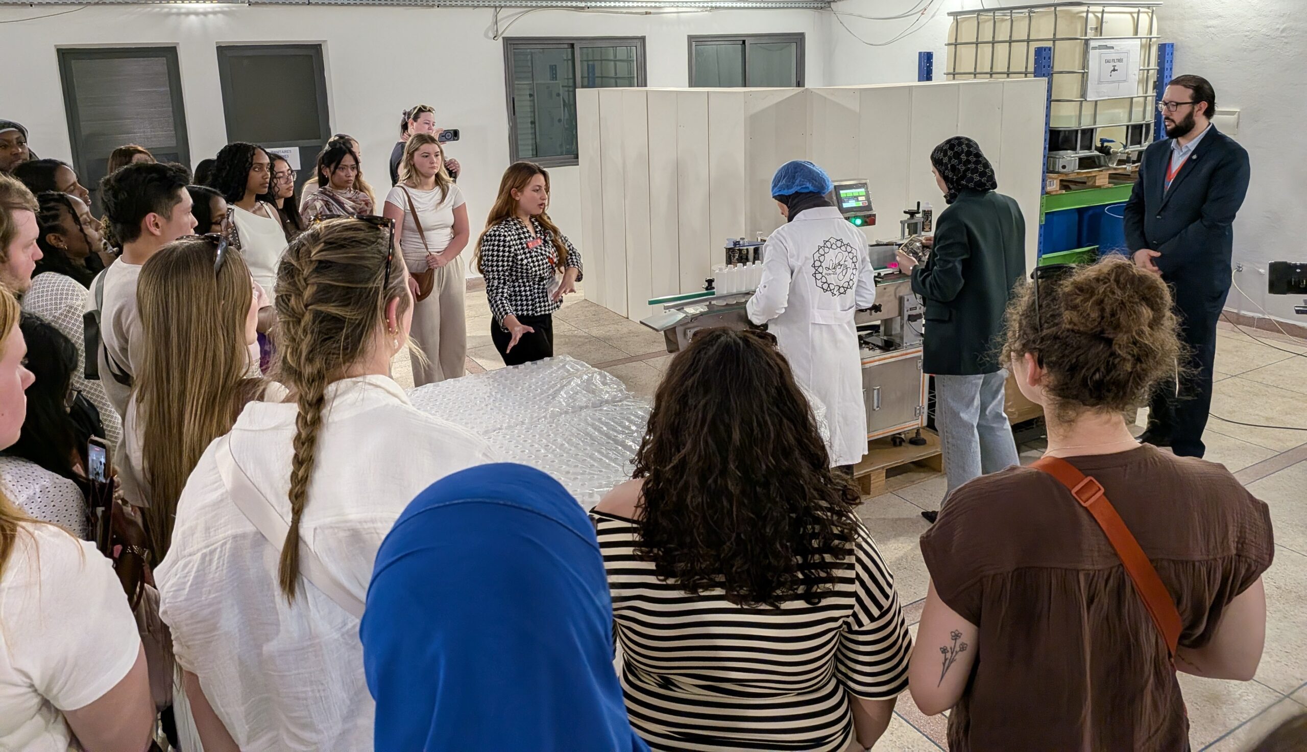 University of Minnesota students touring the Liberty Perfumes production floor